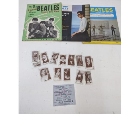A group of ephemera to include two Beatles song albums, a ticket from the Muhammad Ali v Henry Cooper fight on 21 May 1961 an