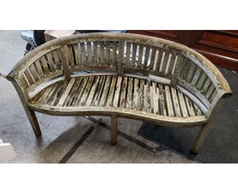 A weathered teak curved garden banana bench 85h x159wLocation GIf there is no condition report shown, please request
