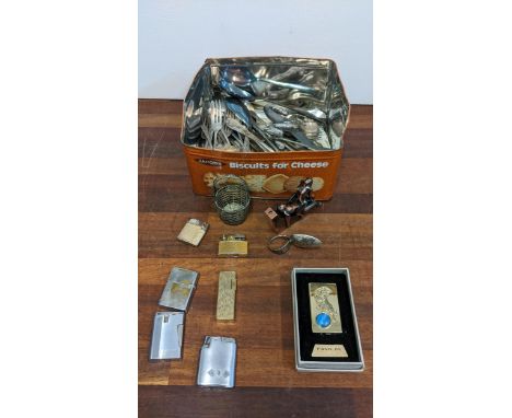 A mixed lot to include a collection of vintage and novelty lighters, mixed flatware, a miniature white metal basket and a hal