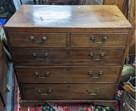 An 18th century mahogany chest of drawers, provincially made with simulated pine sides and a caddy top, with swan neck brass 