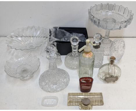 A collection of glassware to include a crystal cut decanter with a silver crown, an inkwell with a silver lid, a Rawlings & s