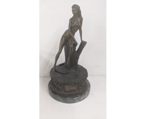 A bronze sculpture of a nude woman resting on a tree stump, on a figural and floral base, titled 'Erotica', on a marble plint