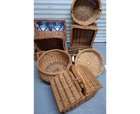 A group of vintage baskets, a partially filled picnic basket and a hardwood wooden box with middle partition and handle. Loca