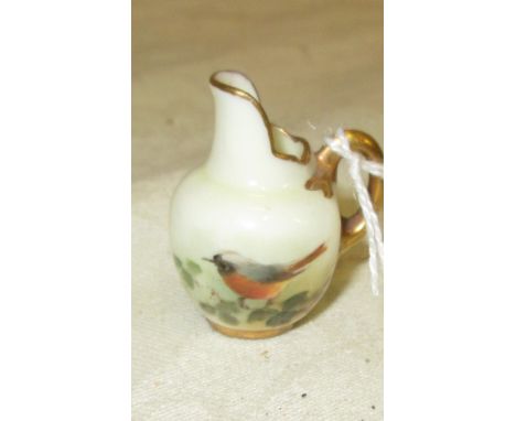 A Royal Worcester miniature jug signed Powell CONDITION REPORT: In very good condition with no chips, cracks or restoration.