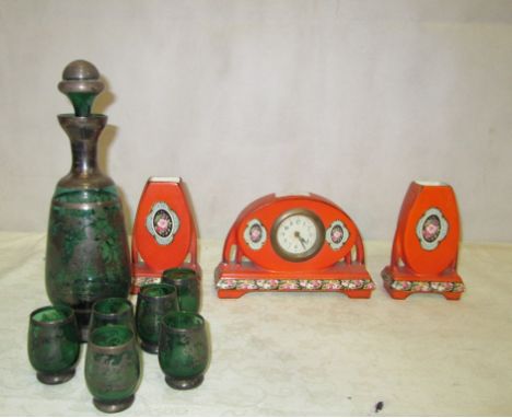 An Art Nouveau clock garniture; together with a silvered green glass decanter and six glasses
