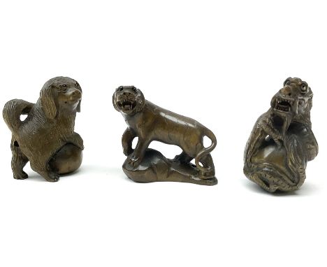 Three netsuke, modelled as a dog, dragon and tiger