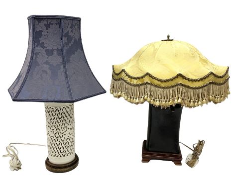 Blanc de Chine style table lamp with pierced foliate decoration, on a hardwood base, with a blue fabric shade, H36cm, togethe