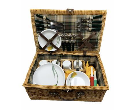Melamine picnic hamper by Euro-Mel, the tableware decorated with yellow flowers and the wicker basket with green tartan linin