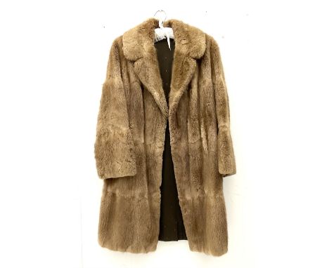 Ladies light brown three quarter length musquash fur coat