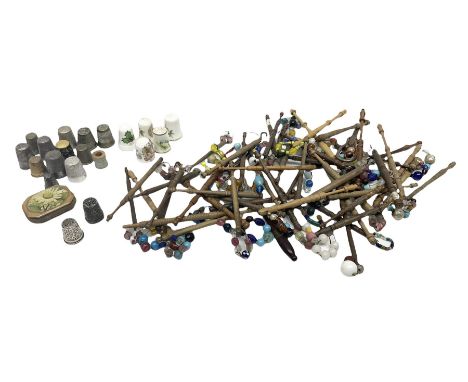 Assorted wooden lace making bobbins, together with a collection of thimbles, including a silver, hallmarked, thimble, Royal W