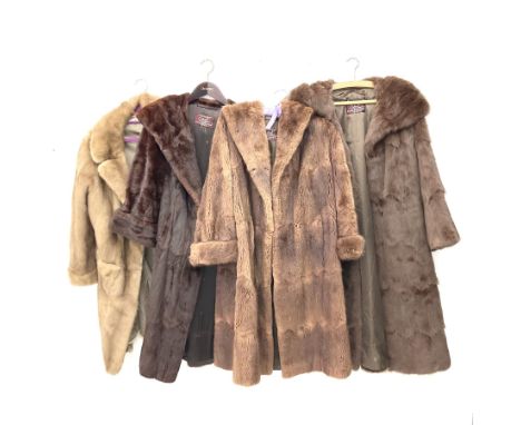 Four ladies three quarter length fur coats, by Dysons Furriers Ltd, Commercial St, Leeds, comprising of a light brown mink fu