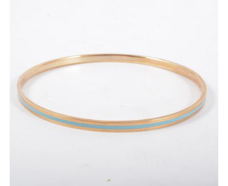 A 9 carat yellow gold upper arm slave bangle, 4.3mm wide, internal diameter 80mm, pale turquoise inset band to centre, hallma