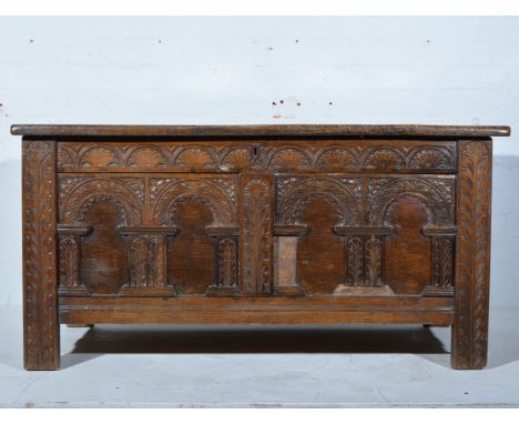 Joined oak coffer, basically late 17th Century, four panel hinged lid, front fascia with applied arcading, width 132cm.