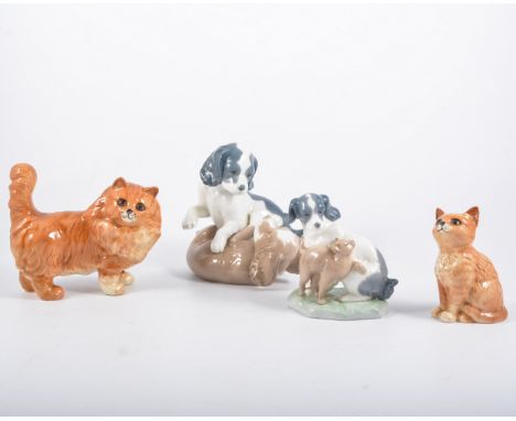 Nao group of two puppies, 16cm; Nao group of a kitten and spaniel; Beswick model of a cat; and a Beswick model of a kitten. (