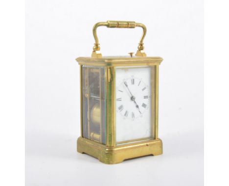 French brass cased repeater carriage clock, rectangular enamelled dial, movement striking on a gong, height 13cm.