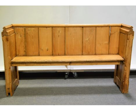 Victorian pine settle, panel back, boarded seat, length 143cm x 43cm, height 79cm.