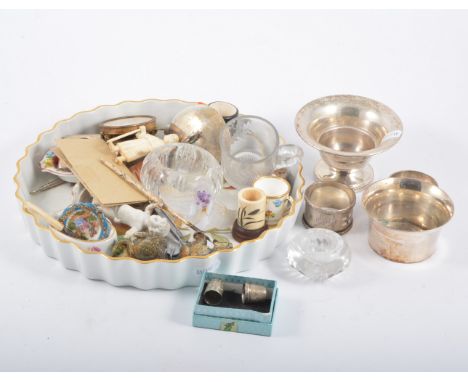 Silver miniature photograph frame, other assorted plated wares and ceramic collectables in a collectors wall unit.