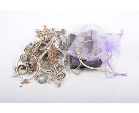 A collection of silver and white metal costume jewellery, earrings, bangles, bracelets, chains, a lady's Tissot bangle watch,