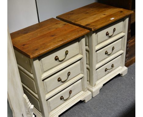 Pair of bedside drawers, stripped pine tops above three graduated drawers, on bracket feet, cream painted finish, each 56cm w