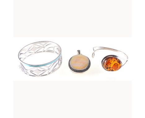 Fiorelli - A silver bangle 25mm wide with turquoise enamel border and set with scrolls of cubic zirconia, a silver bangle set