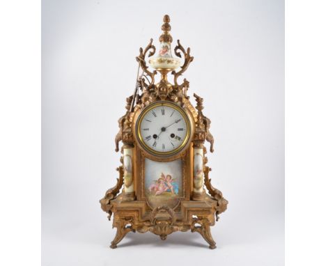 Early 20th Century gilt metal porcelain panel mantel clock, circular white enamelled dial Roman numerals, above shaped hand p