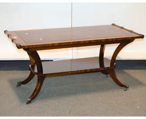 Reproduction mahogany coffee table, leather inset top, splayed legs joined by a shelf, the top 103cm x 52cm, height 48cm.