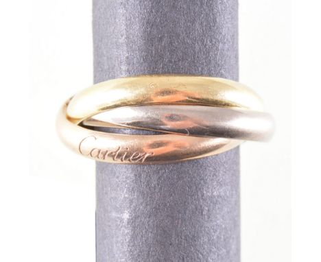 Cartier - A yellow, red and white metal trinity wedding band, plain polished finish 2.8mm wide bands stamped 750, numbered SP