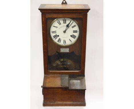 A VINTAGE OAK CASED 'NATIONAL TIME RECORDER Co. Ltd' CLOCKING IN CLOCK, with painted letters to the glazed door, H 82 cmCondi