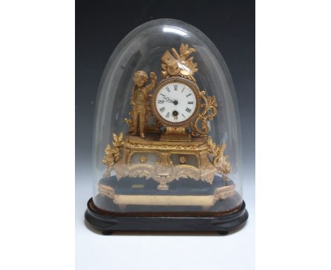 A 19TH CENTURY CONTINENTAL GILT METAL TABLE CLOCK, with figurative detail, standing on a gilt wooden plinth, housed in a glas