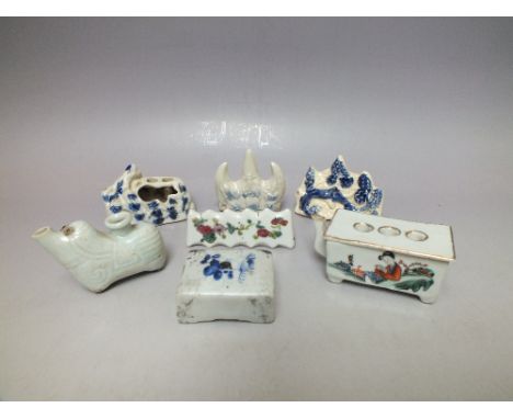 A SELECTION OF FIVE CHINESE TYPE WATER DROPPERS ETC, to include blue and white examples, together with two ceramic brush hold