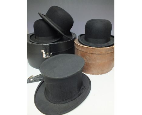 A VINTAGE COLLAPSIBLE TOP HAT BY H M STANLEY, together with three vintage bowler hats comprising a Henry Heath example, plus 