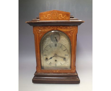 A LATE VICTORIAN INLAID MAHOGANY EIGHT DAY BRACKET CLOCK, the stepped case of architectural form ,silvered dial with Roman nu