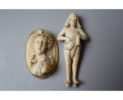 AN EARLY 20TH CENTURY CARVED IVORY FIGURE, H 7.2 cm, together with a carved bone relief portrait cameo style panel, H 5 cm