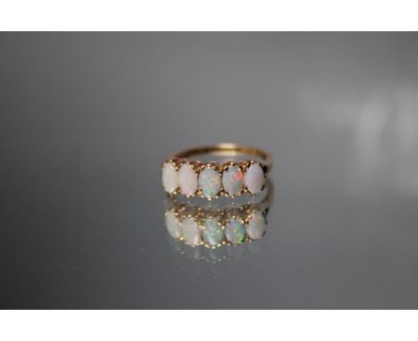 A FIVE STONE OPAL RING, set in Chester hallmarked 9 carat gold, ring size P