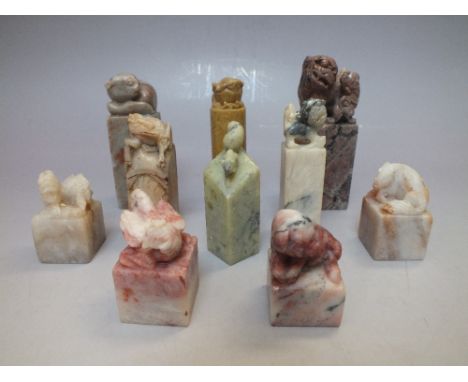 A COLLECTION OF VINTAGE CHINESE CHOPS / SEALS, of varying forms, mainly hardstone examples with carved mythical beasts surmou