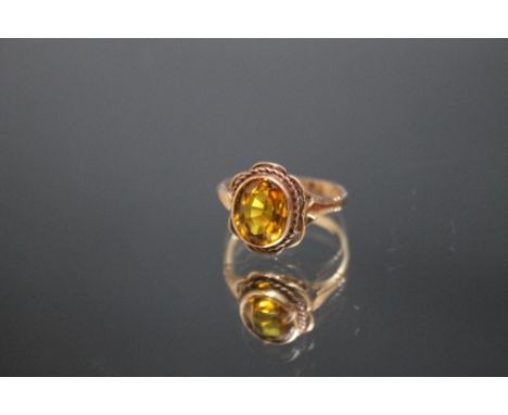 A HALLMARKED 9 CARAT GOLD DRESS RING, set with an oval citrine type stone, ring size N