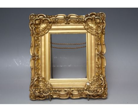 A 19TH CENTURY DECORATIVE MINIATURE PORTRAIT GOLD FRAME, with slip, frame W 4 cm, slip rebate 4 x 11 cm, frame rebate 6 x 13 