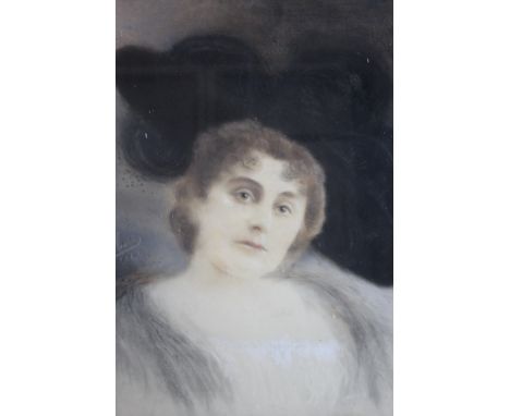A HEAD AND SHOULDER PORTRAIT STUDY OF A LADY WEARING A LARGE BLACK HAT, signed and dated 1899 middle left, pastels on paper l