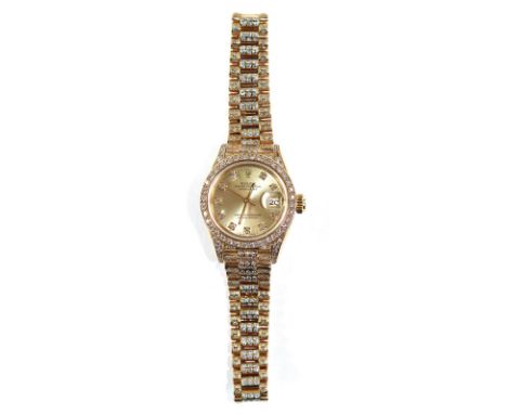 Rolex Damenarmbanduhr: mit Oyster Perpetual Datejust-Armband. Ungefähr 1989. Gehäuse aus 18 Kt. Gelbgold mit diamantbesetzter