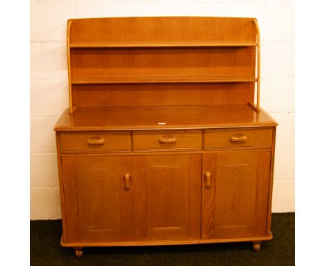 An Ercol style elm sideboard, with plate-rack, drawers and cupboards CONDITION REPORT; Approximately 130 cm high x 120 cm wid