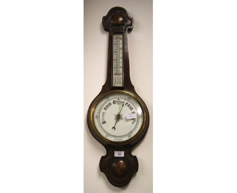 Oak carved android barometer with detachable thermometer  CONDITION REPORT; Approximately 80 cm long