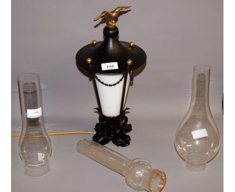 A contemporary knewl-post electric light fitting and three clear glass oil lamp chimneys CONDITION REPORT; Approximately 38 c