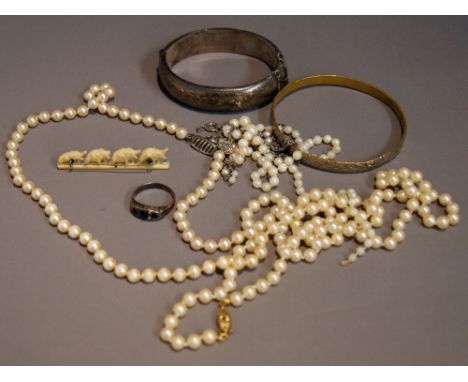 A quantity of costume jewellery to include hallmarked silver bangle and an ivory brooch. 