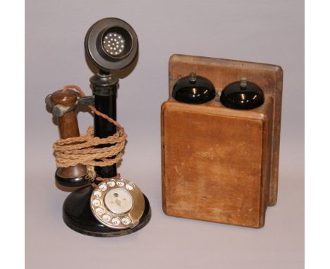 An early 20th Century candlestick telephone in bakelite and steel, together with its bell box. CONDITION REPORT; Phone is app