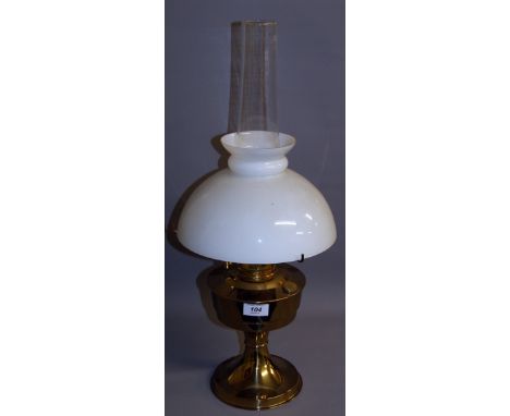 An unused Aladdin brass oil lamp with white glass shade CONDITION REPORT; Approximately 60 cm tall including glass