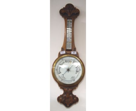 Oak carved aneroid barometer with detachable thermometer CONDITION REPORT; Approximately 80 cm tall