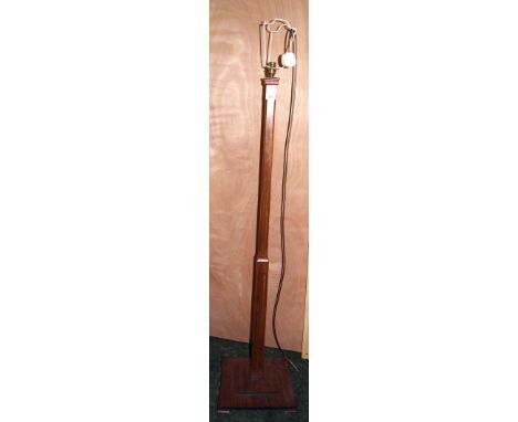 A mahogany standard lamp, reeded column raised on a square stepped base CONDITION REPORT; Approximately 152 cm tall