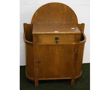 An Art Deco oak hall stand, with two stick stands flanking a single door cupboard and single drawer CONDITION REPORT; Approxi