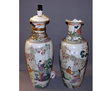 A pair of 19th century Chinese vases, each with mirroring figural designs to the body. No marks to the bases. One vase having