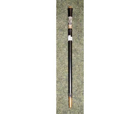 An ebonised cased sword stick, early 20th Century, with carved horn grip and brass lion-mask pommel. Approximately 88cm long